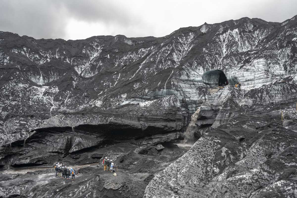 ice cave with two groups of people